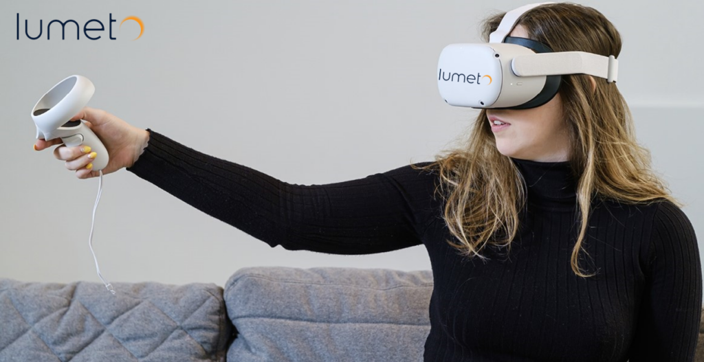 A student wearing a virtual reality headset with the Lumeto logo on it, holding a VR controller in her hand.