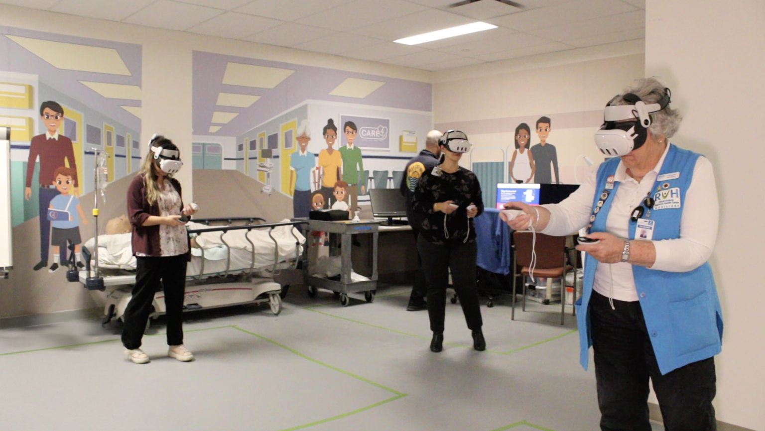 Three healthcare workers wearing VR headsets participate in a virtual stroke training simulation at Royal Victoria Regional Health Centre using Lumeto’s InvolveXR.