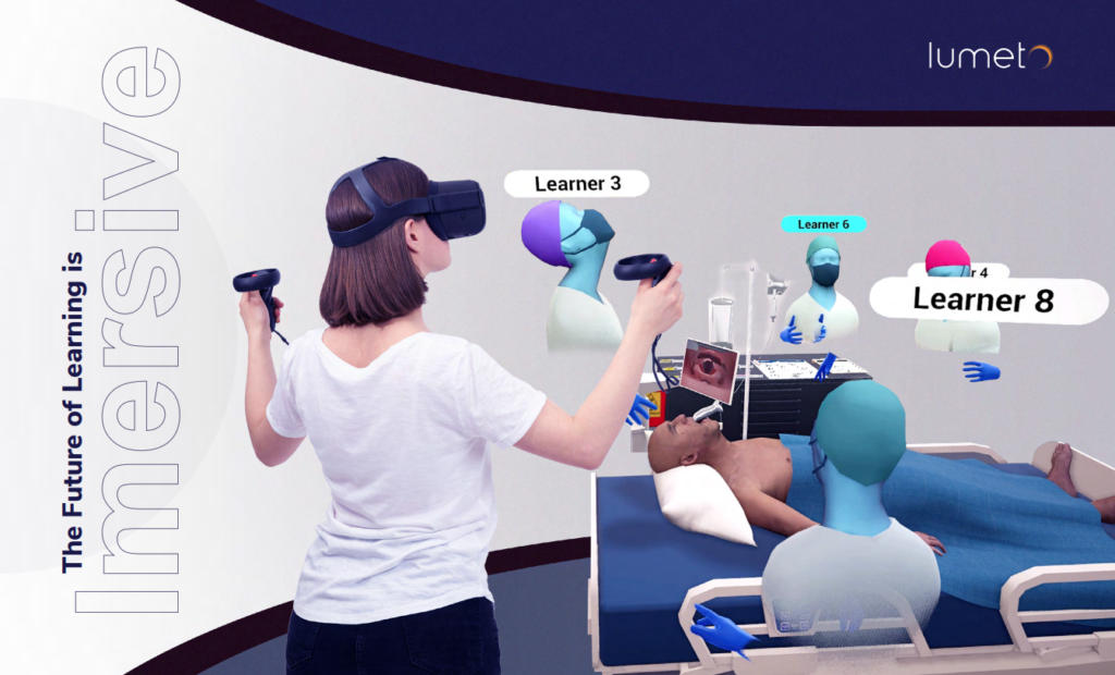 A person wearing a VR headset and holding controllers is immersed in a virtual healthcare training simulation. Surrounding them are virtual avatars labeled as learners, and a virtual patient on a hospital bed with medical equipment nearby.